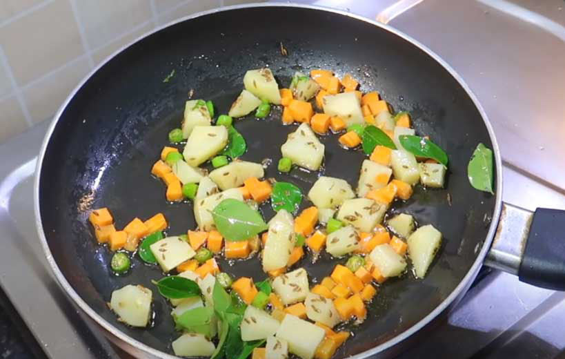 cumin potato green chili in pan